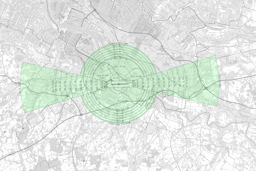 Detaillierte Karte eines Bauschutzbereichs um einen Flughafen mit konzentrischen Schutzzonen und Anflugsektoren.